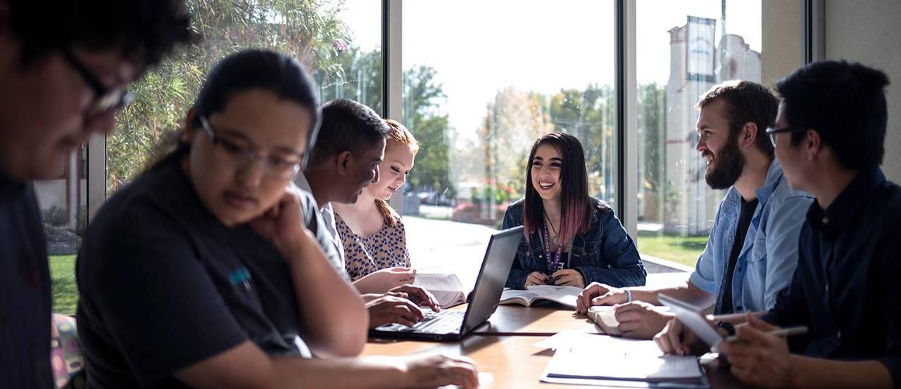 A group of students studying at a table